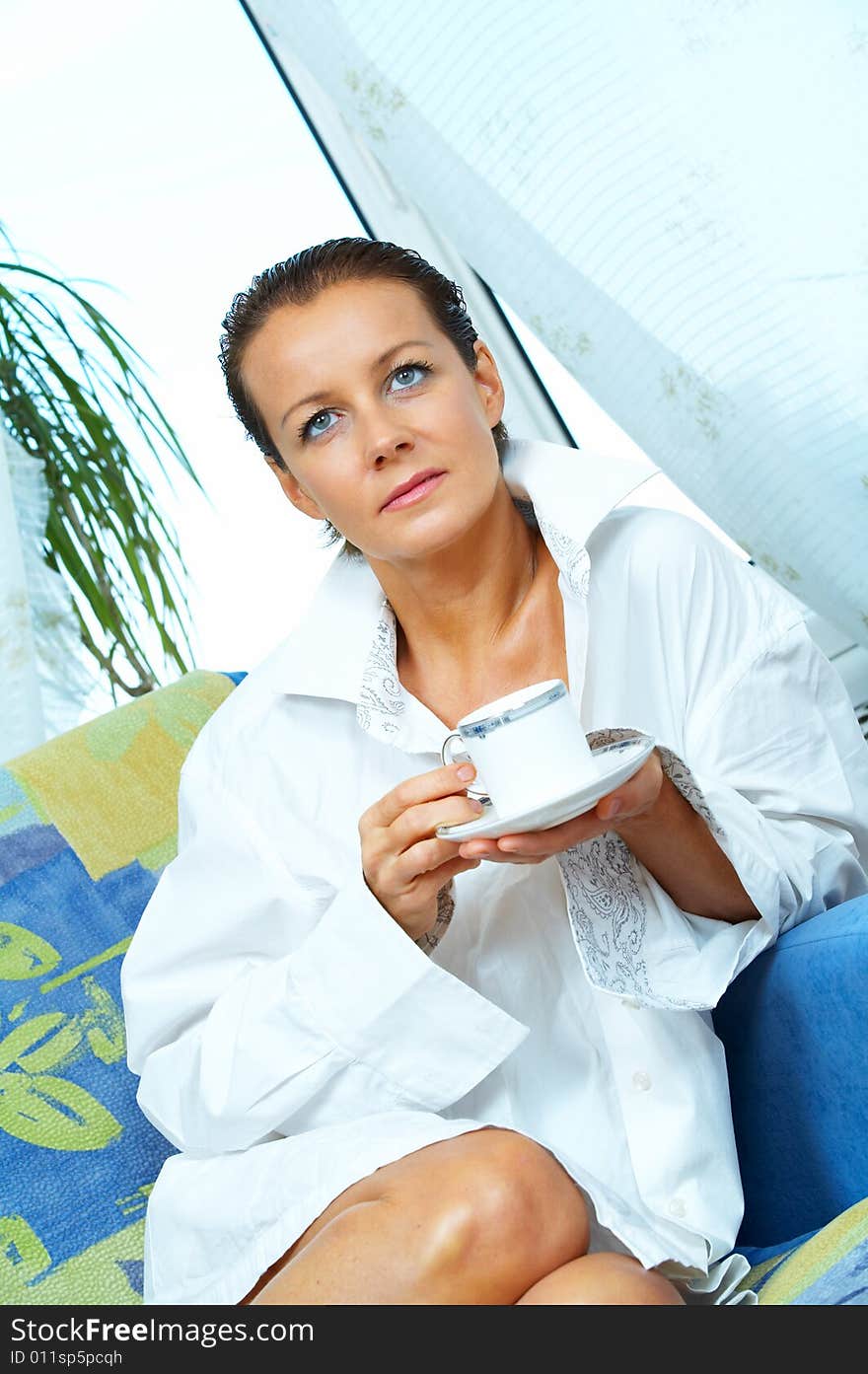 High key portrait of nice gorgeous woman drinking coffee. High key portrait of nice gorgeous woman drinking coffee