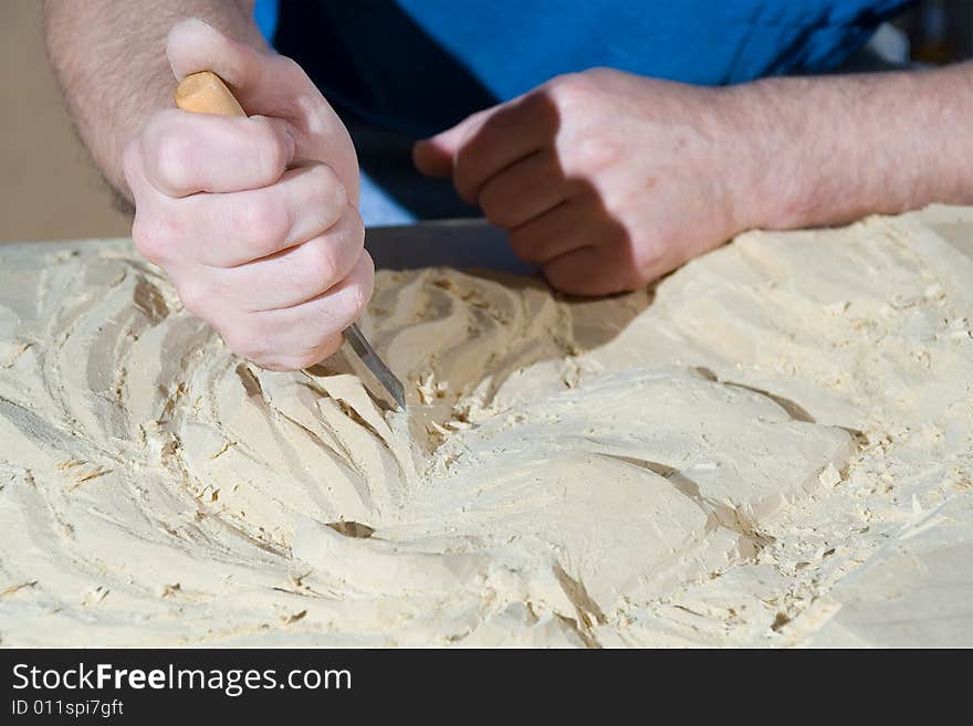 Hands of the carver. work place. Hands of the carver. work place