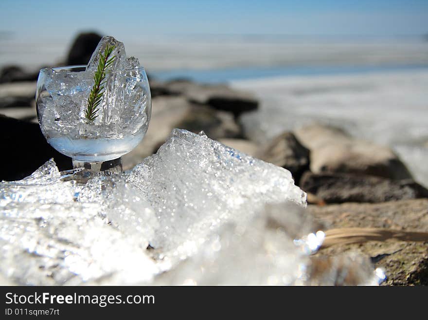 Glasses with ice on the edge of a frozen lake