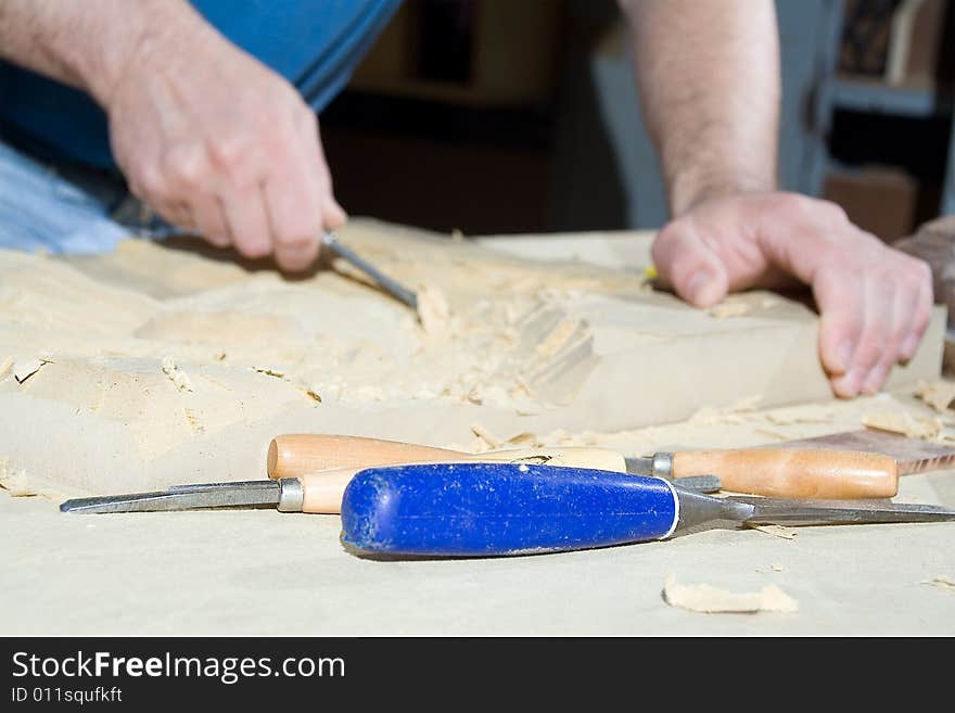 Hands of the carver.work place. Hands of the carver.work place