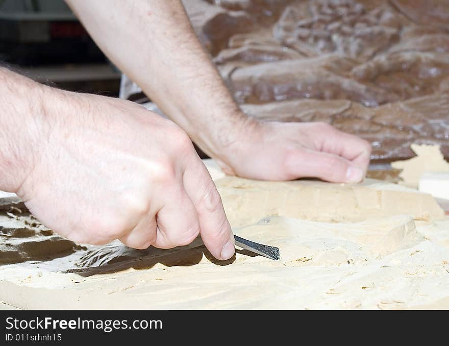 Hands of the carver. Work place. Hands of the carver. Work place