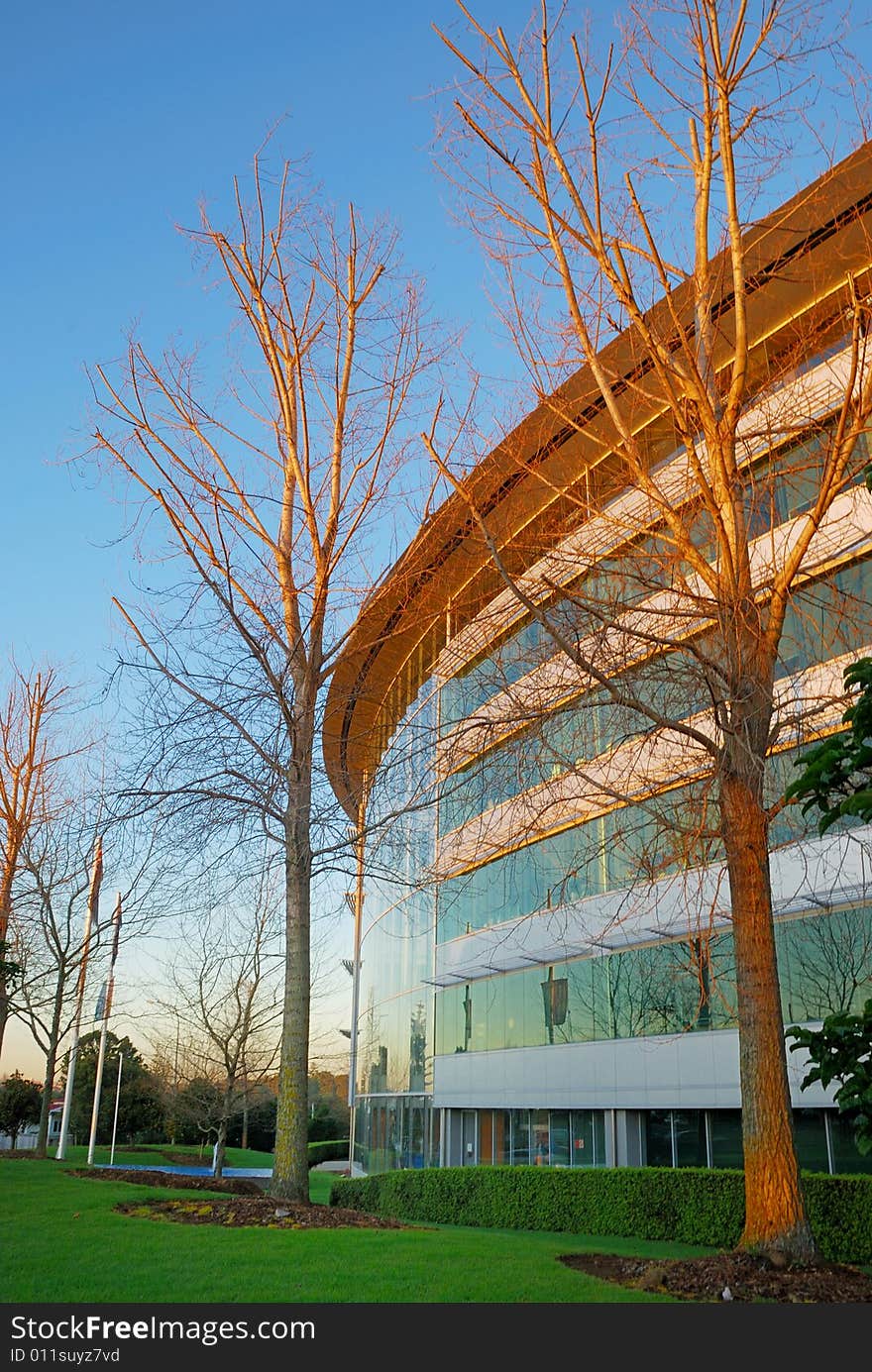 Modern office building in sunrise light