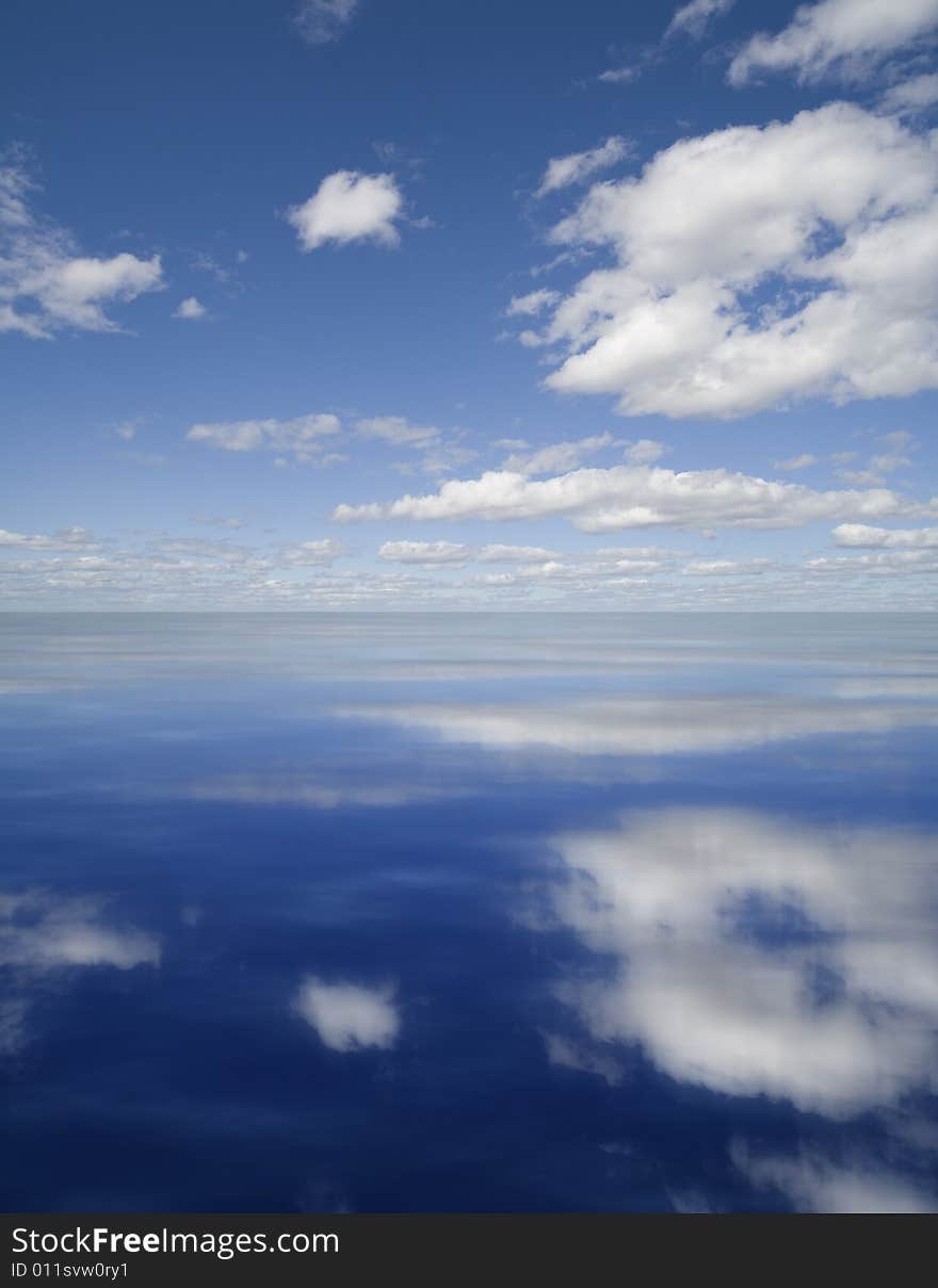 Clouds reflected in dark water. Clouds reflected in dark water