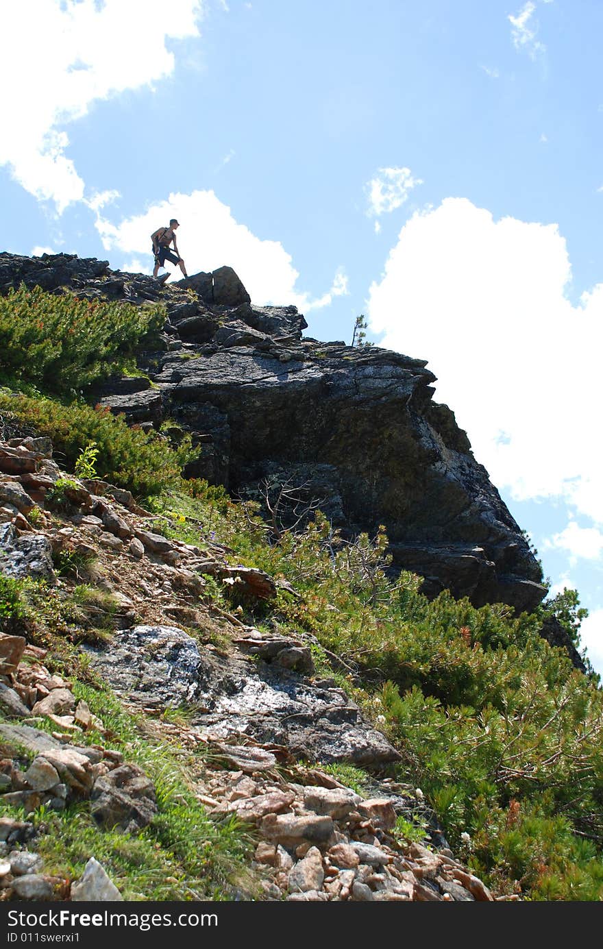 Mountain, sky and the man on the top