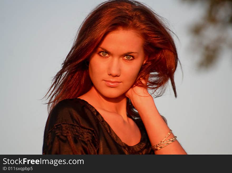 Portrait of a young lady in light of the evening sun