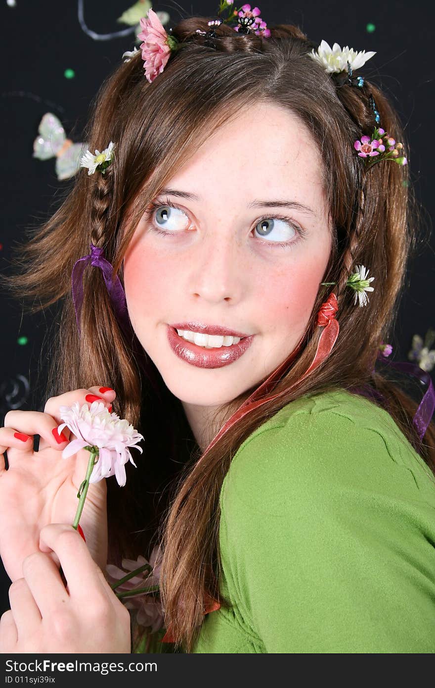 Teenage model with flowers and butterflies in her hair. Teenage model with flowers and butterflies in her hair