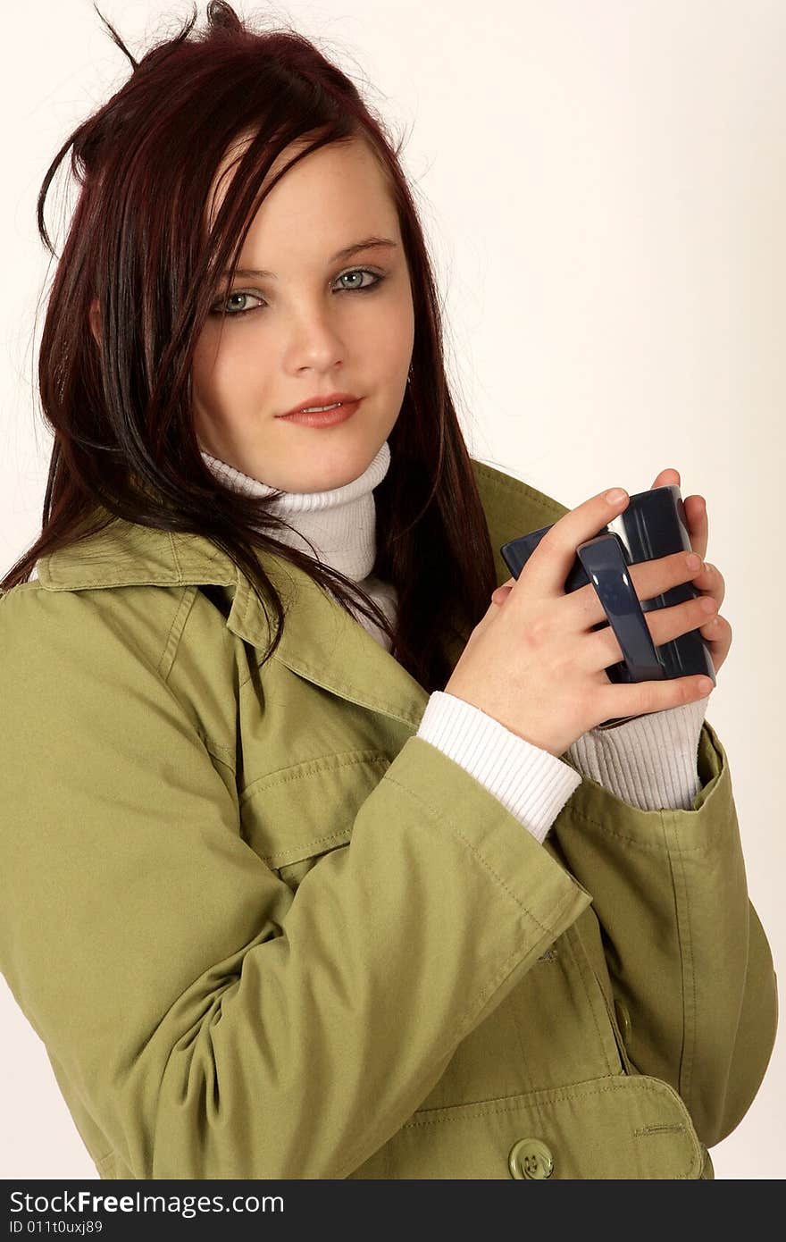 A woman holding a coffee mug