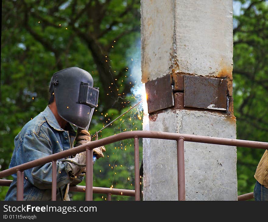 Welder at work joining metal