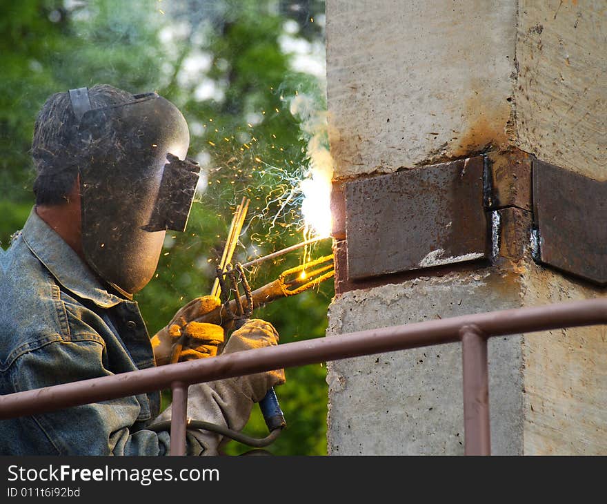 Welder at work joining metal