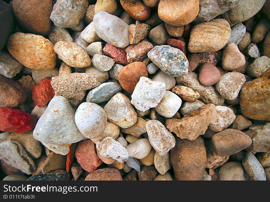 Colorful river stone solid background. Colorful river stone solid background