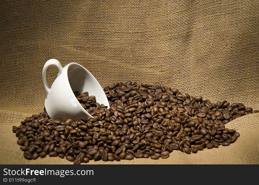 Coffee beans with a cup of coffee. Coffee beans with a cup of coffee