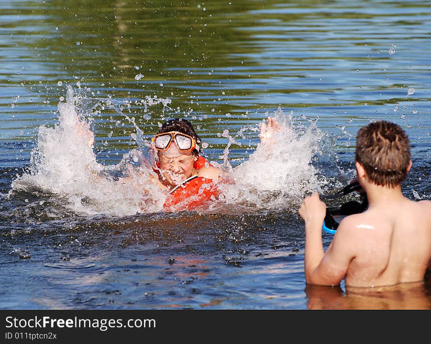 The boy is watching as his friend is getting angry. The boy is watching as his friend is getting angry.