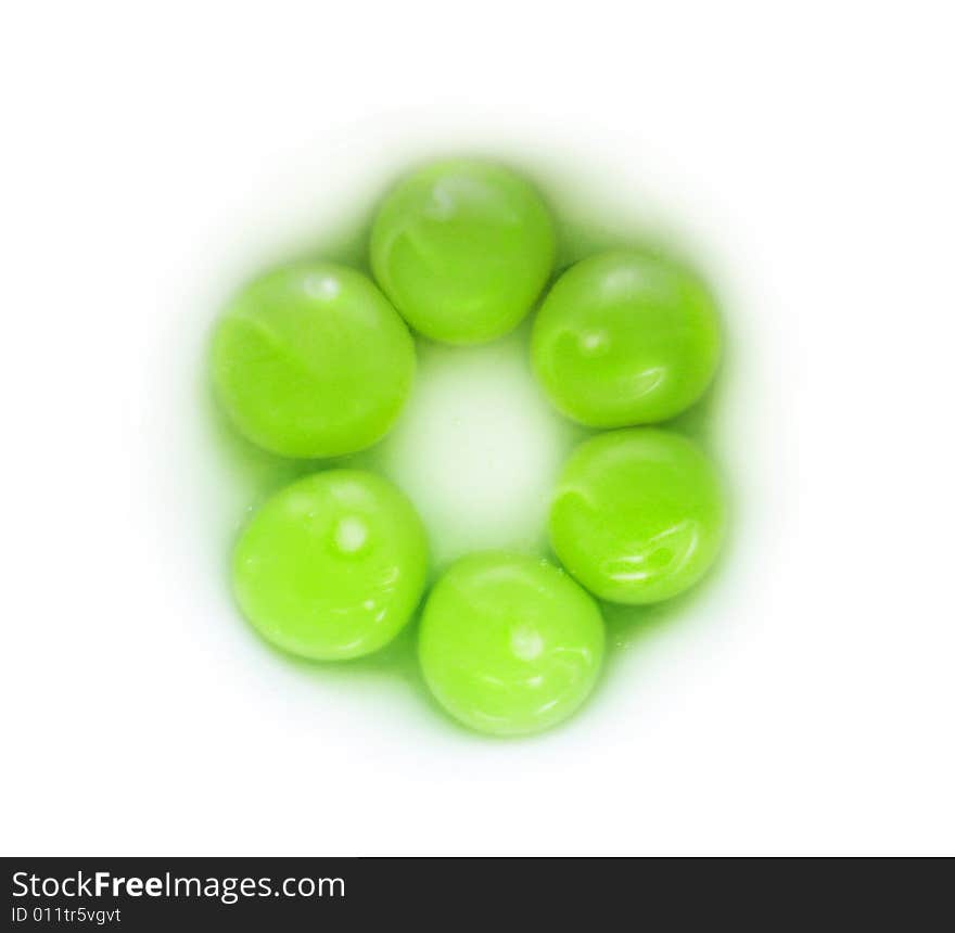 Photo of the raw egg yolks painted in green colour. Photo of the raw egg yolks painted in green colour