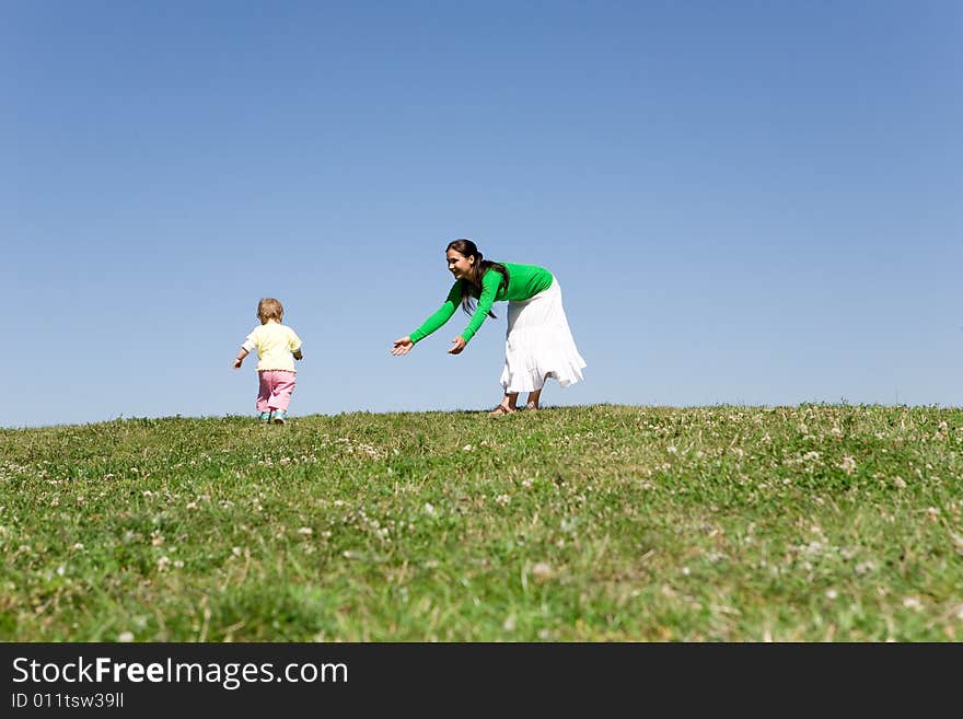 Active family on green meadow. Active family on green meadow