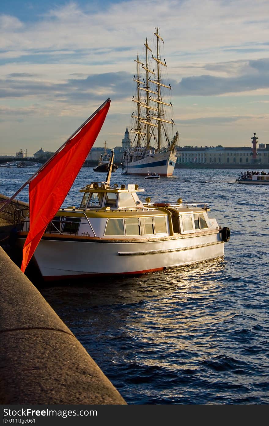 Frigate Mir is a Russian state sailing ship, registered at Saint Petersburg, Russia. The Mir anchored in Neva river. Evening, sunset. Frigate Mir is a Russian state sailing ship, registered at Saint Petersburg, Russia. The Mir anchored in Neva river. Evening, sunset.