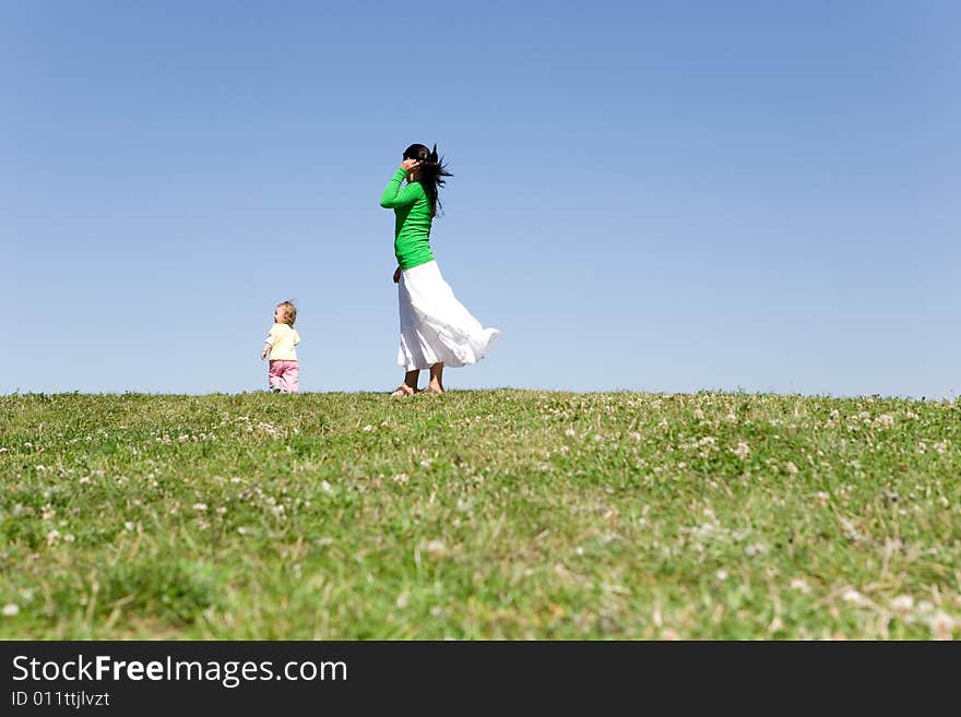 Active family on green meadow. Active family on green meadow