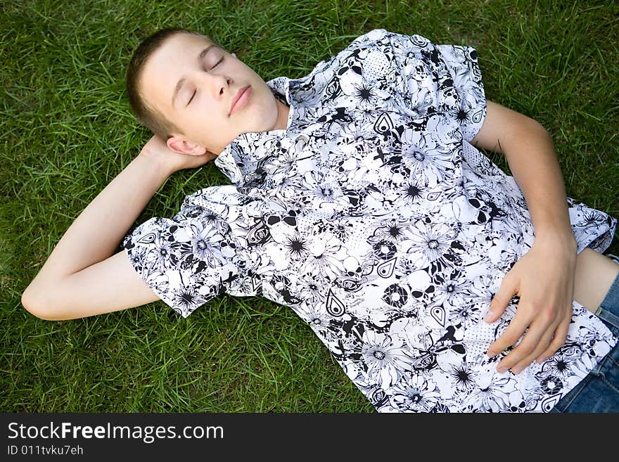 Happy boy lying on grass. Happy boy lying on grass