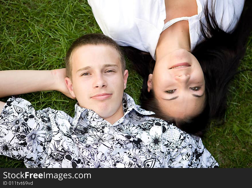 Happy family lying on grass. Happy family lying on grass