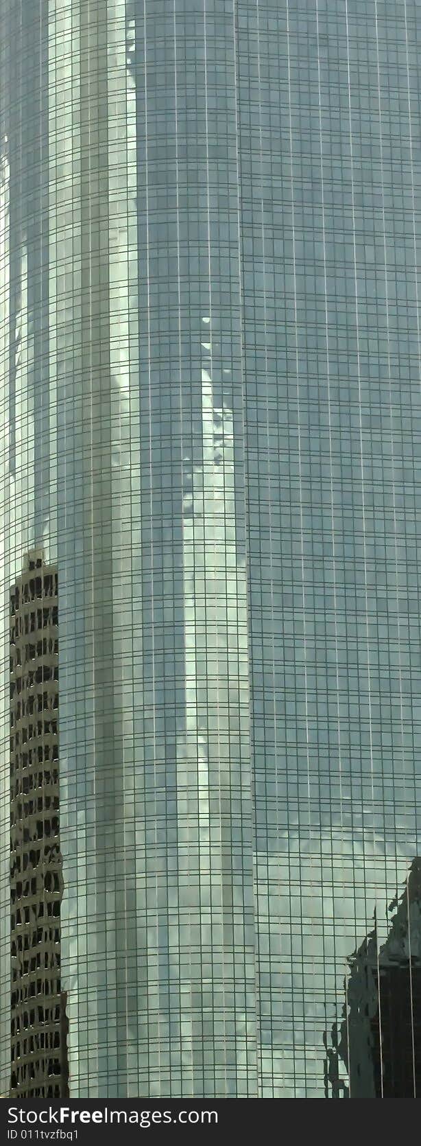 A skyscrapers windows with reflections. A skyscrapers windows with reflections.