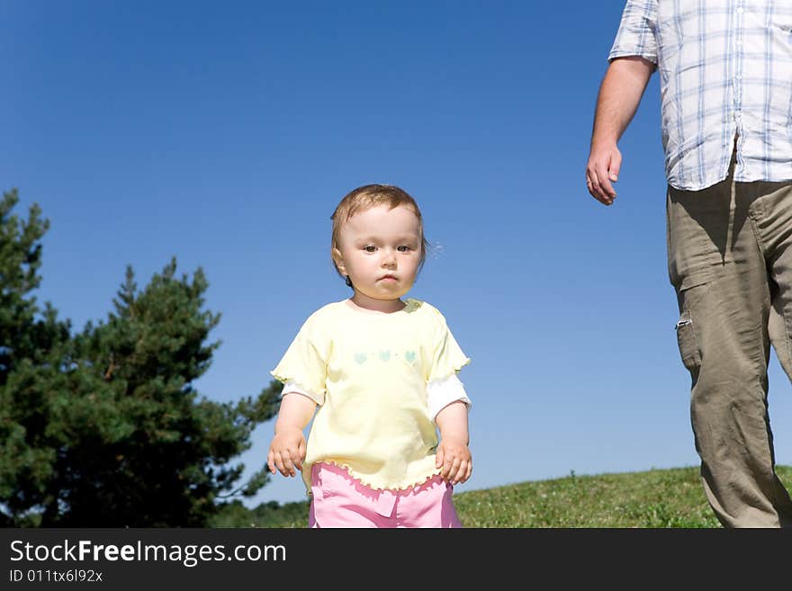 Happy family on green meadow. Happy family on green meadow