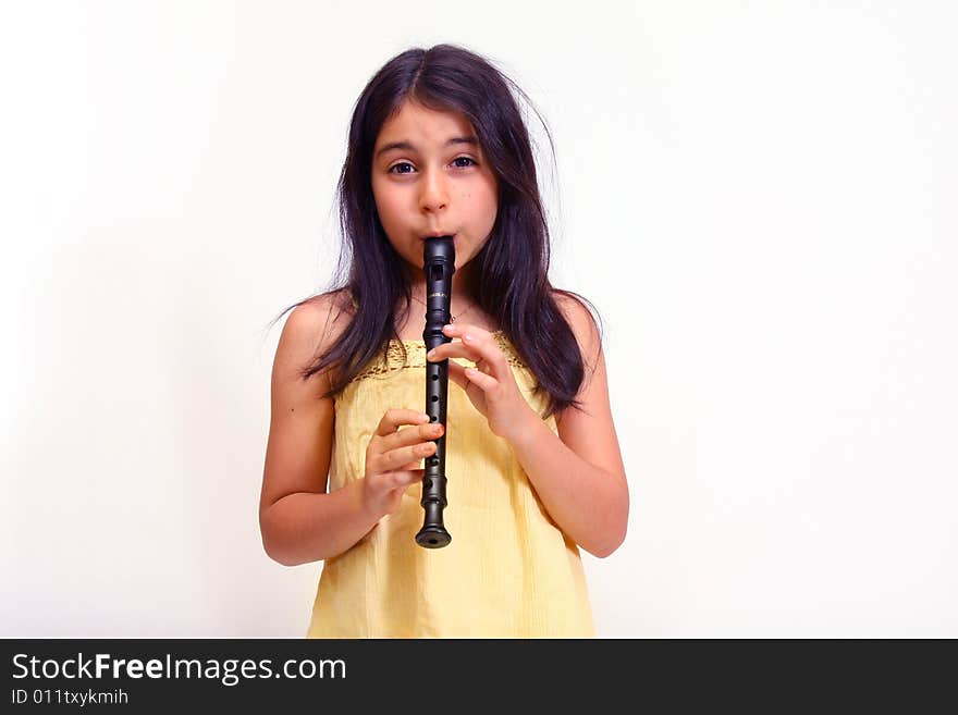 Young girl playing recorder