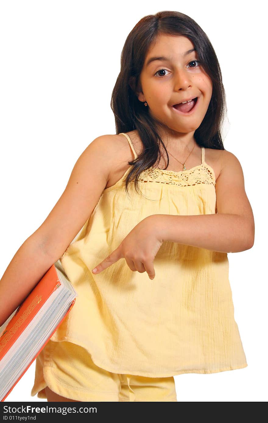 8 year old girl holding a large book. 8 year old girl holding a large book