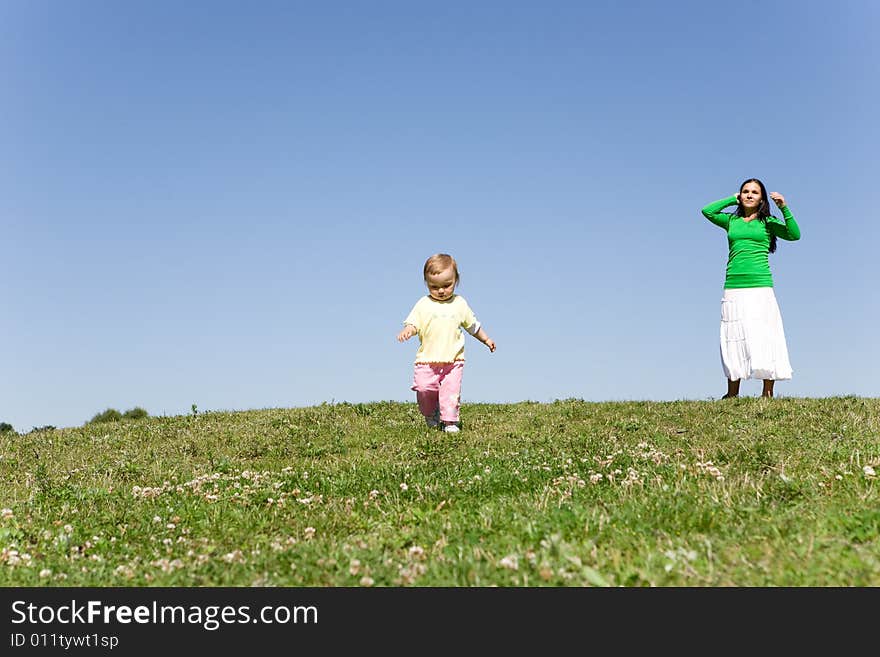 Active family on green meadow. Active family on green meadow