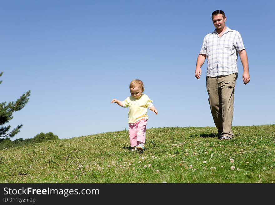 Happy family on green meadow. Happy family on green meadow