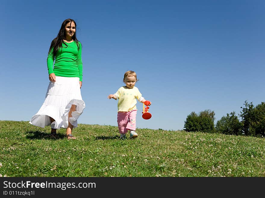 Active family on green meadow. Active family on green meadow