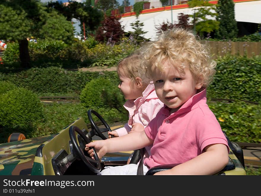 Cute young boy and girl in a car. Cute young boy and girl in a car