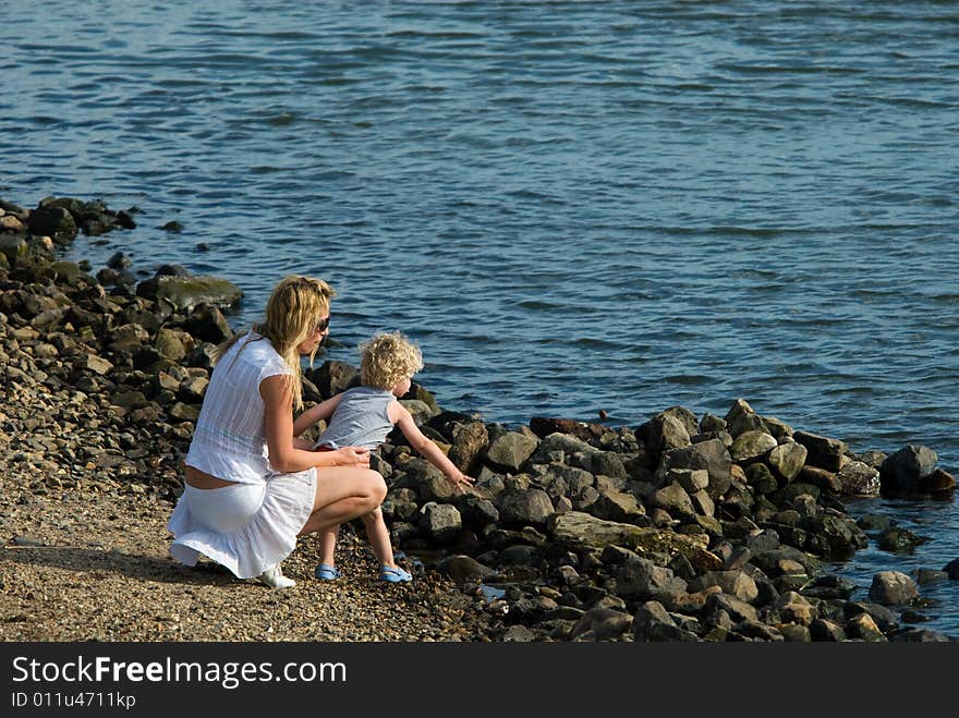 Mother and son having fun on the waterfront