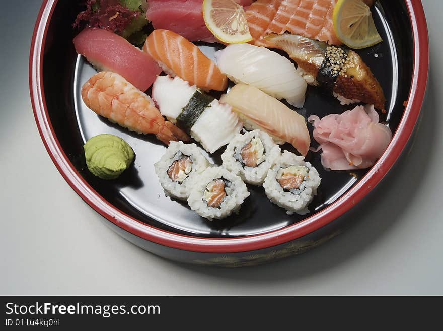 Sushi on round ceramic plate