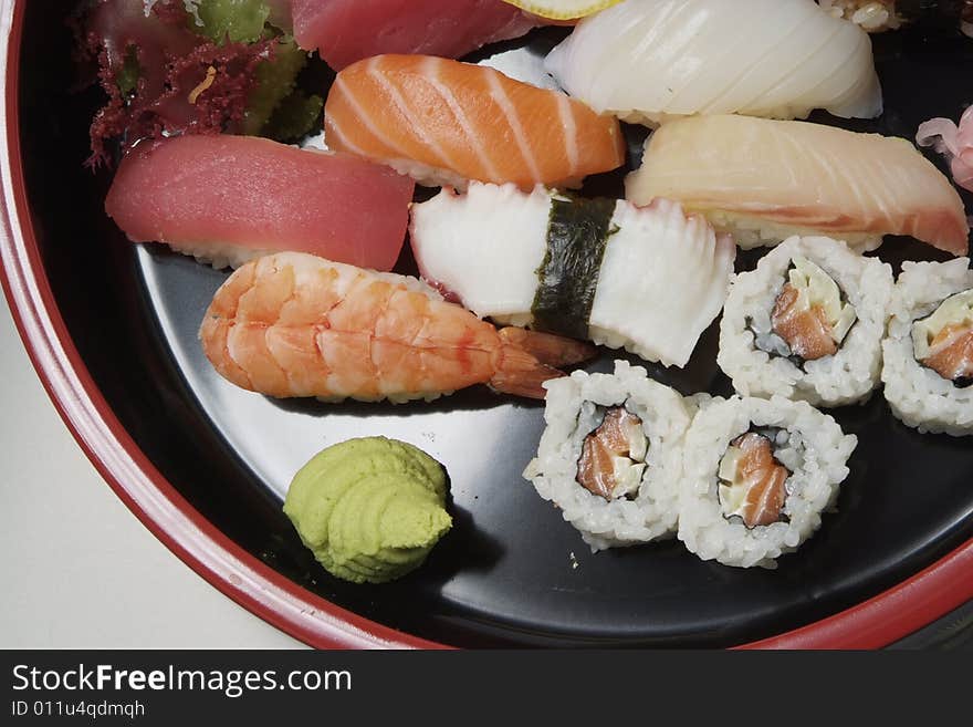 Sushi on round ceramic plate