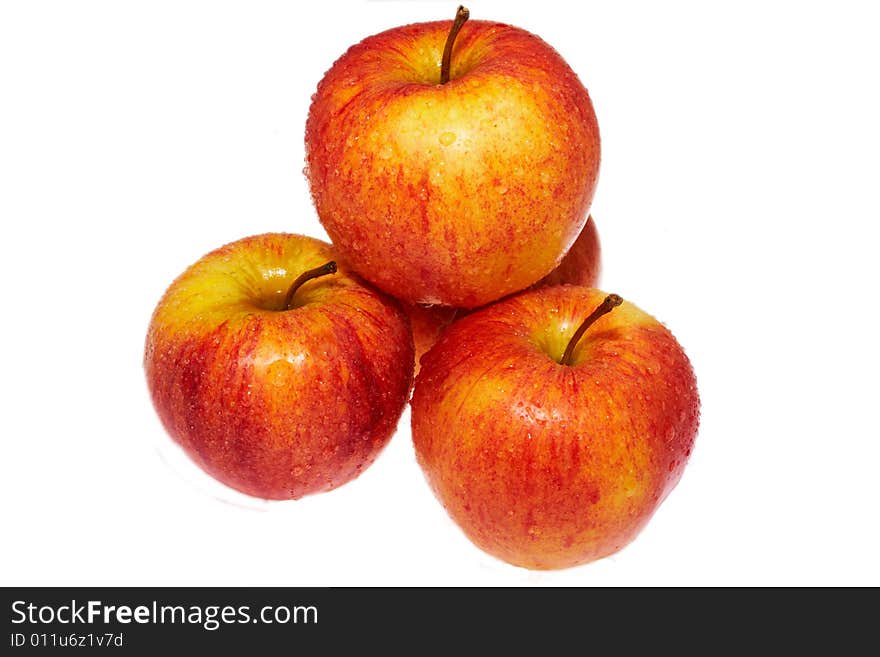 Wet red apples isolated on white background