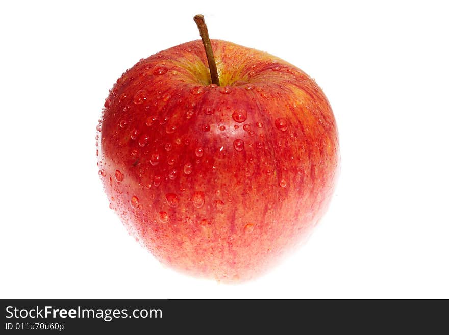 Wet red apple isolated on white background