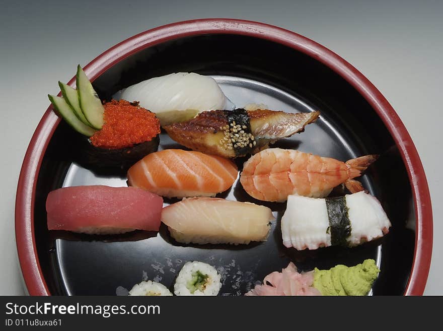 Sushi japanese food on ceramic round plate