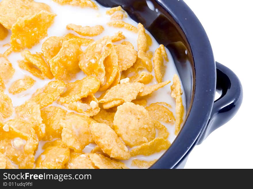 A bowl of cornflakes with milk - healthy diet