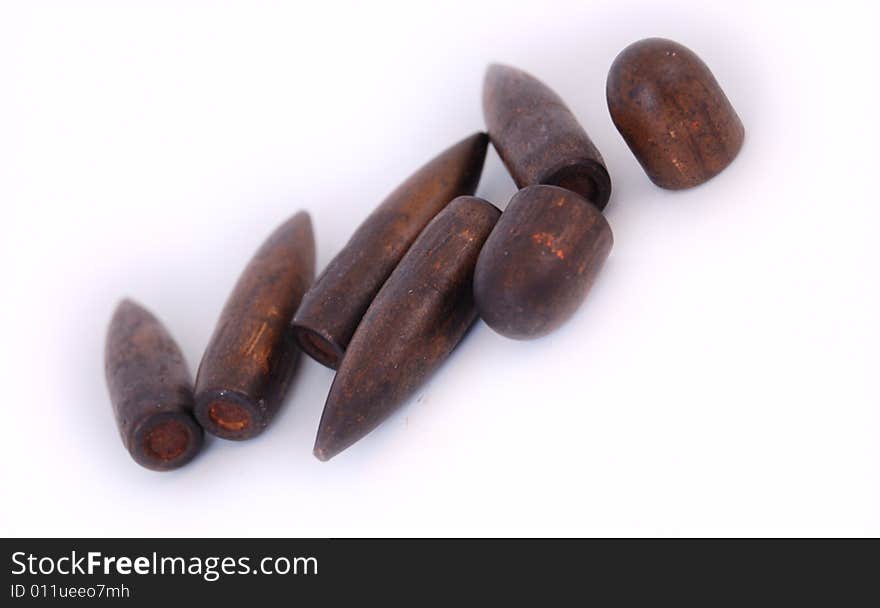 Macro set of old used 7,62 mm bullets of AK47 and of 9 mm TT isolated on white. Macro set of old used 7,62 mm bullets of AK47 and of 9 mm TT isolated on white