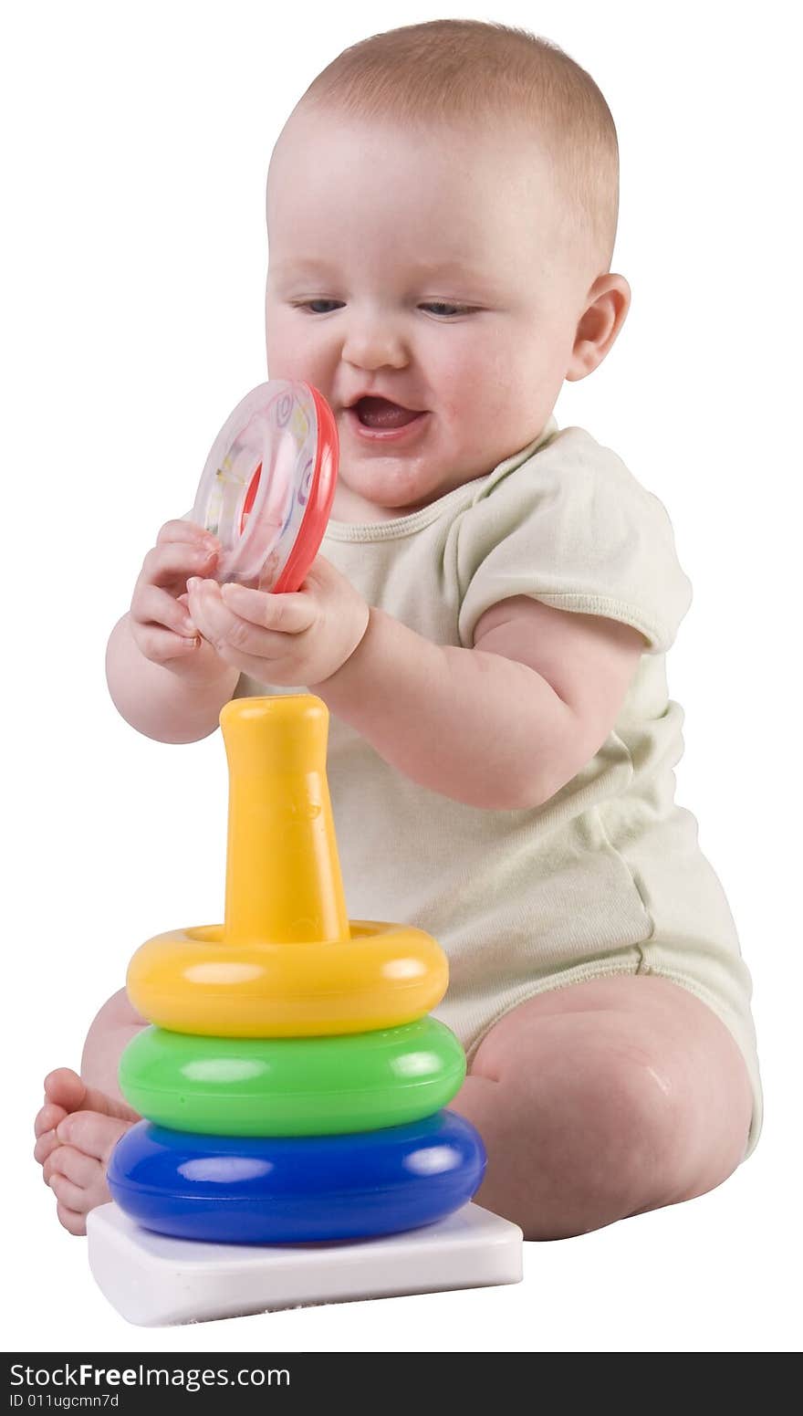 Baby girl playing with stacking rings. Baby girl playing with stacking rings.