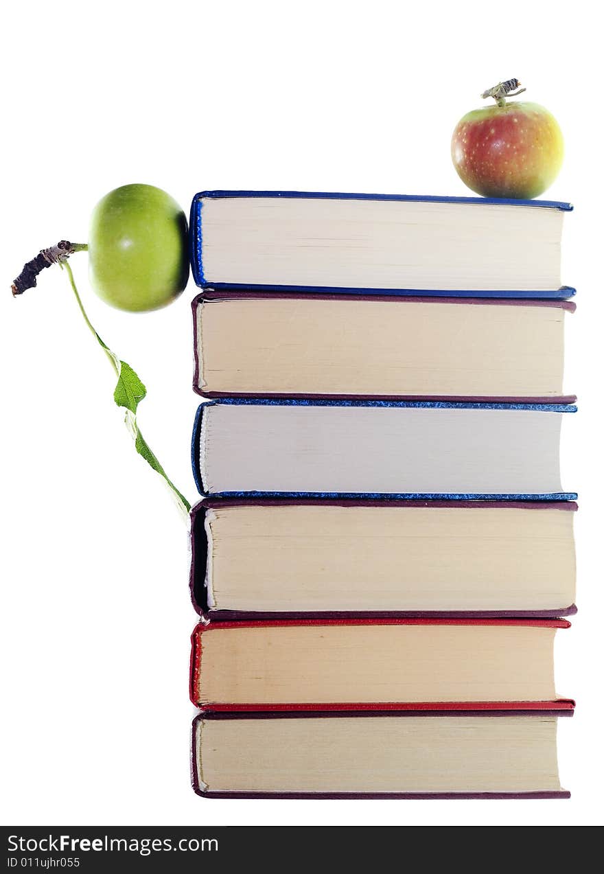 Apples on stack of books isolated on white background