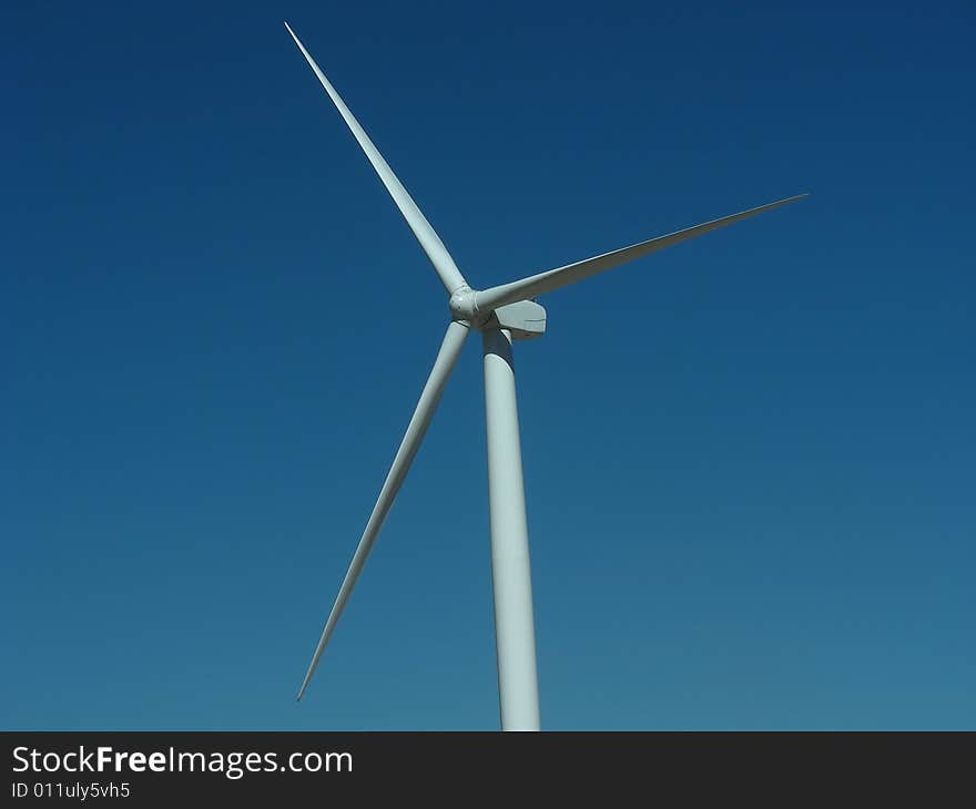 Closeup of the blades of a wind turbine.