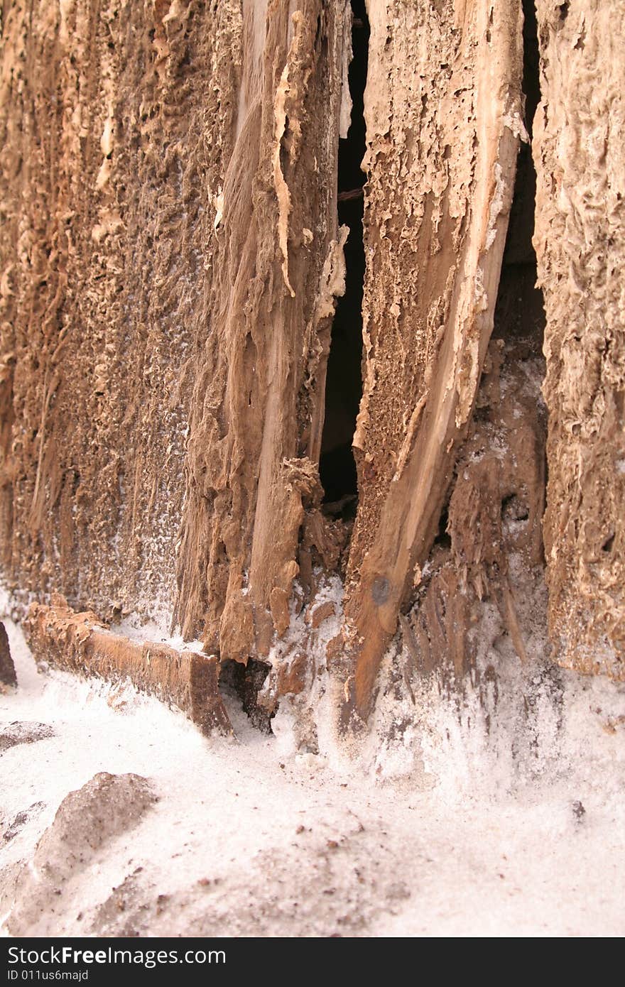 Fragment of an old wall by the sea that has been weathered by time, salt, and rust; vertical orientation. Fragment of an old wall by the sea that has been weathered by time, salt, and rust; vertical orientation.