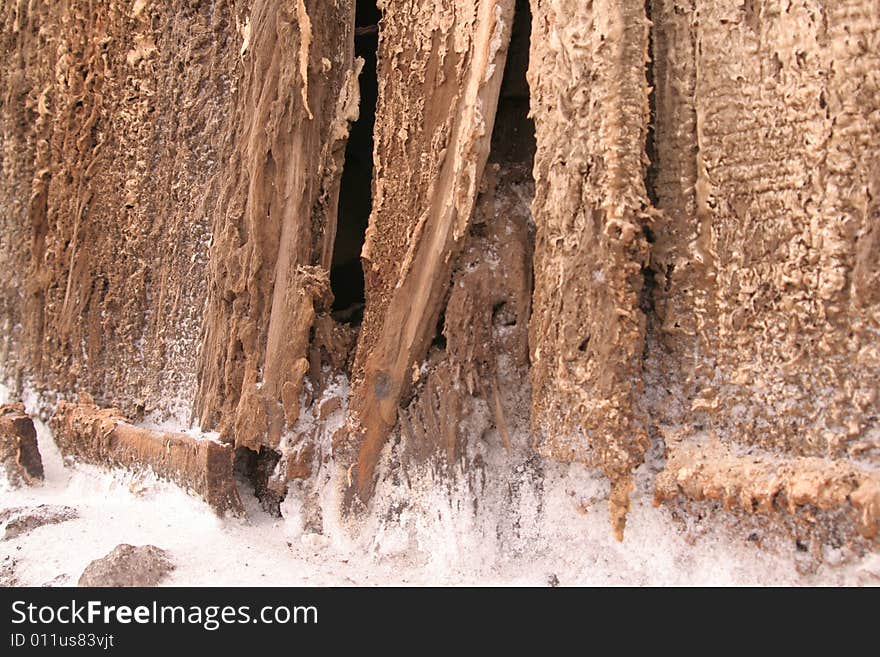 Fragment of an old wooden wall by the sea that has been weathered by time, salt, and rust. Fragment of an old wooden wall by the sea that has been weathered by time, salt, and rust.