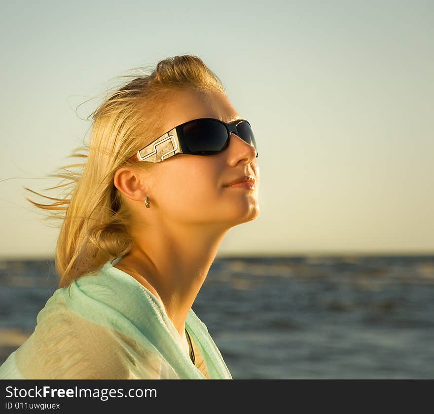 Woman relaxing near the ocean