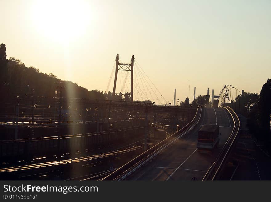 The bridge over the railway on the way to seaport of the city of Odessa, Ukraine, on a sunset