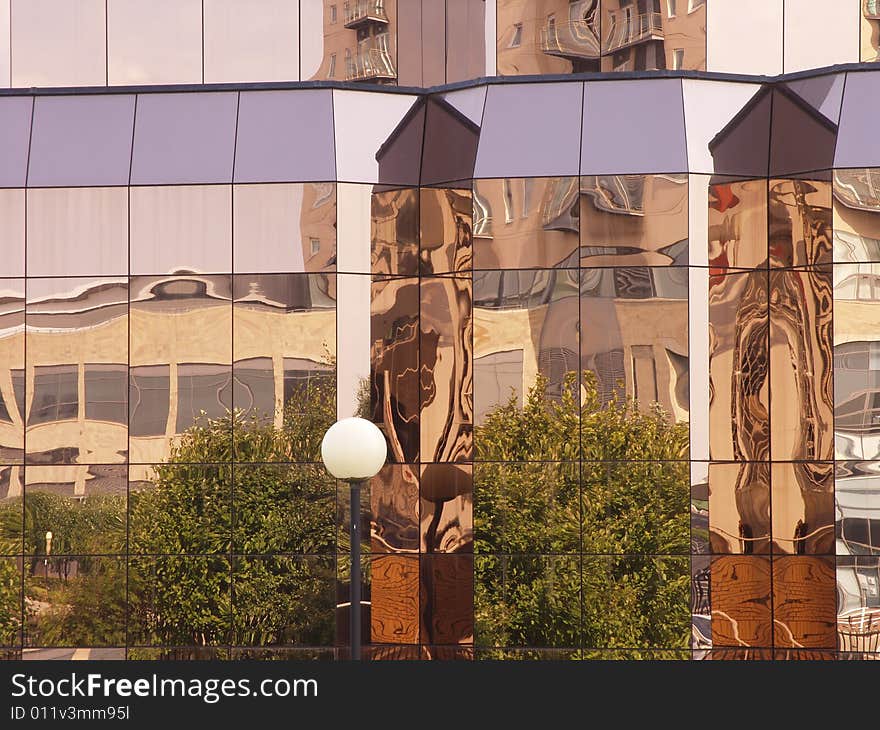 Building windows reflecting surrounding archiecture. Building windows reflecting surrounding archiecture.