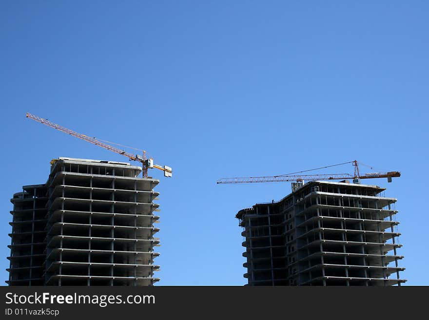 Cranes on a building site of two buildings of hotel in the city of Odessa, Ukraine