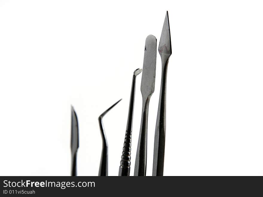 Stock pictures of metal dental instruments used to work on patients