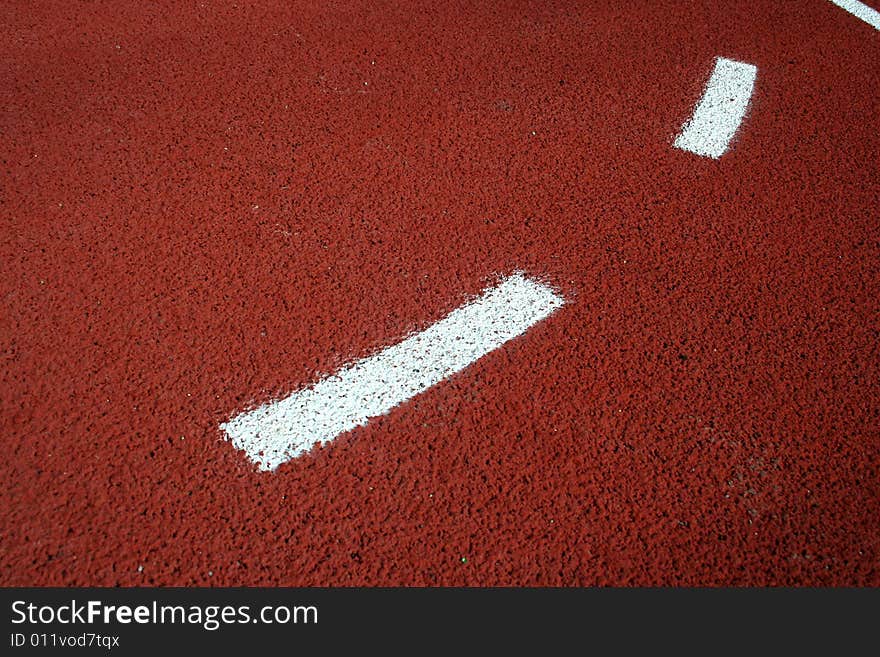 Detail of basketball field with rubber floor and markings on it