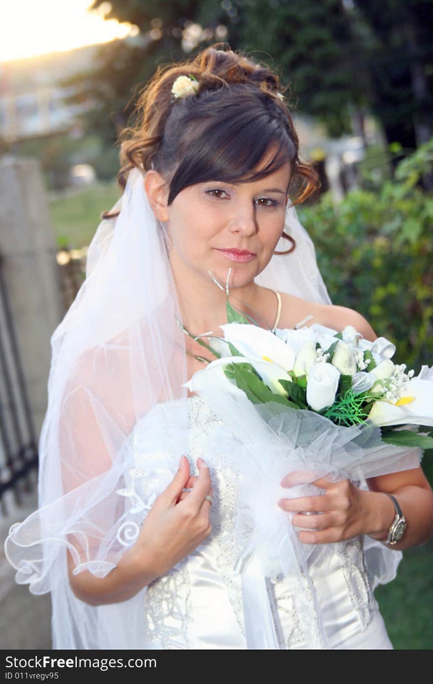 Beautiful happy bride standing outdoor. Beautiful happy bride standing outdoor